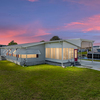 RV Lot for Sale: Waterfront RV Port Home on a Half Acre Lot with an 80' Long Port, Polk City, FL