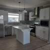 Open Kitchen featuring stainless steel appliances and serving bar.