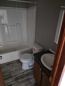 Photo of #1982AB 2000 Model Re-furbished Champion 28x60, 3 bedroom, 2 bath w/ appliances!