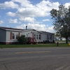 Double wide home by main entrance.