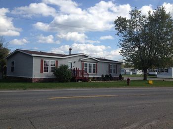 Double wide home by main entrance.