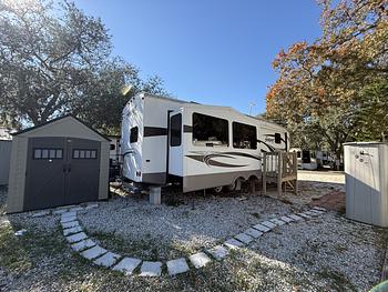 Photo of 2014 spacious 5th wheel Rv on private Rv lot in gated community