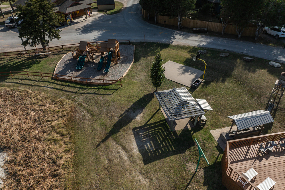 Gazebo, mining play set, basket ball court and brand new play set.